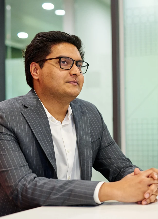 a businessman sitting looking at someone