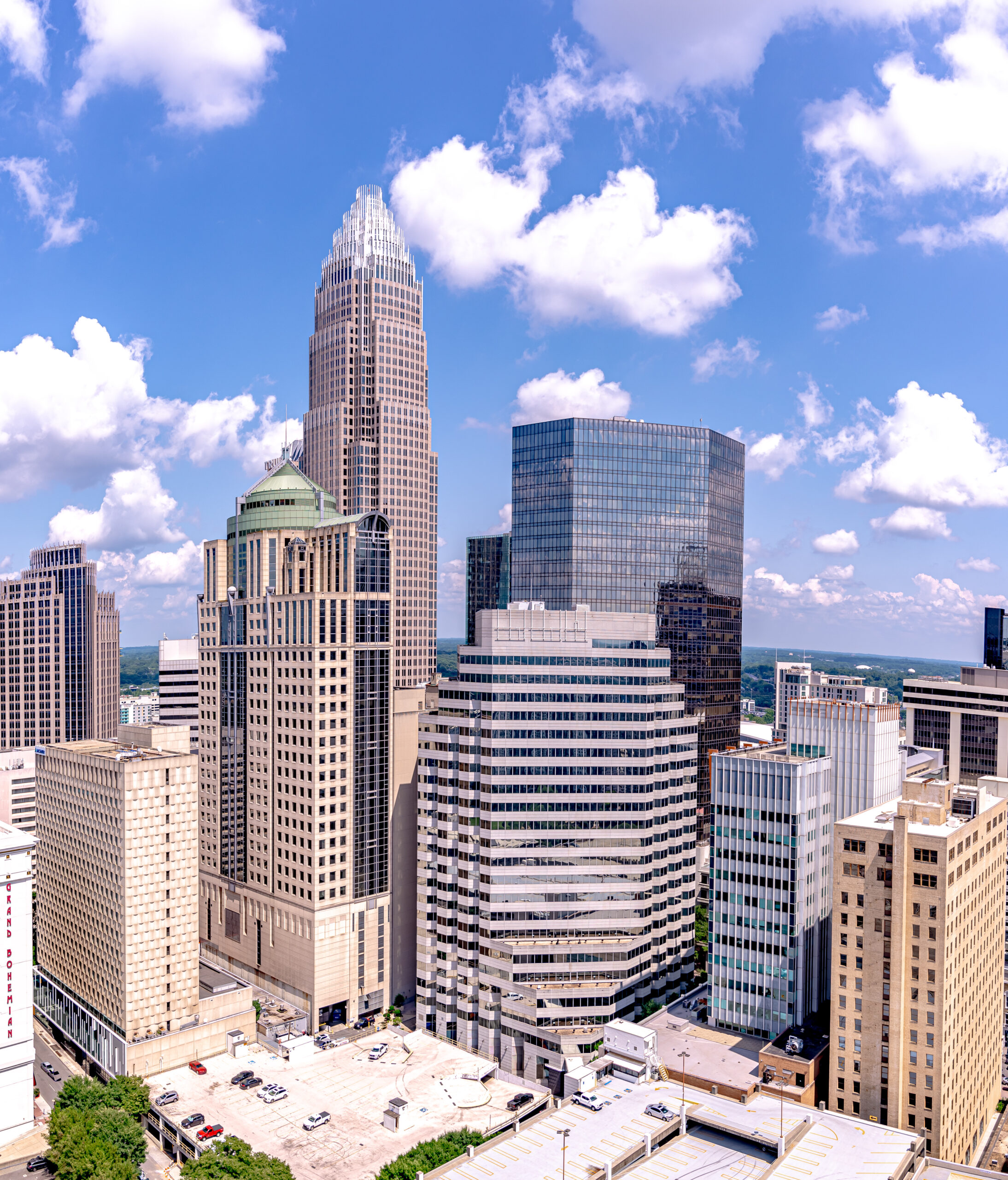 cityscape view of Charlotte in North Carolina against a backdrop of cloudy blue sky